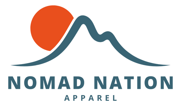 Noman Nation Apparel logo of orange sun over blue mountain outline on white background. 